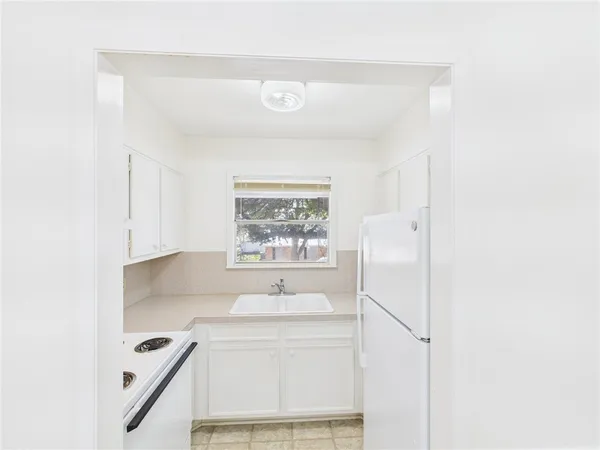 a bathroom with a sink a vanity and a mirror