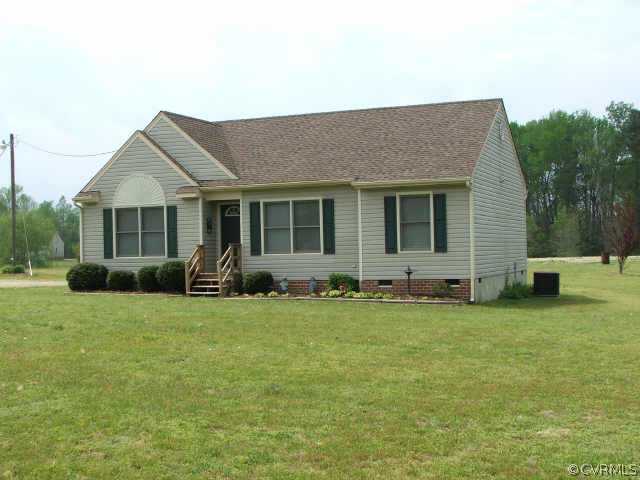 17270 Loving Union Road Disputanta, VA 23842 - Photo 1 of 7 a view of a house with a backyard
