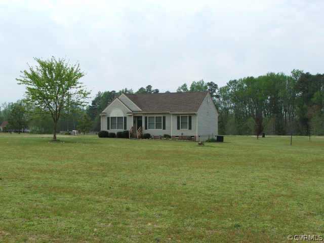 17270 Loving Union Road Disputanta, VA 23842 - Photo 3 of 7 a front view of a house with garden