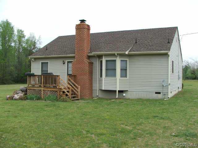 17270 Loving Union Road Disputanta, VA 23842 - Photo 6 of 7 a view of a house with a yard