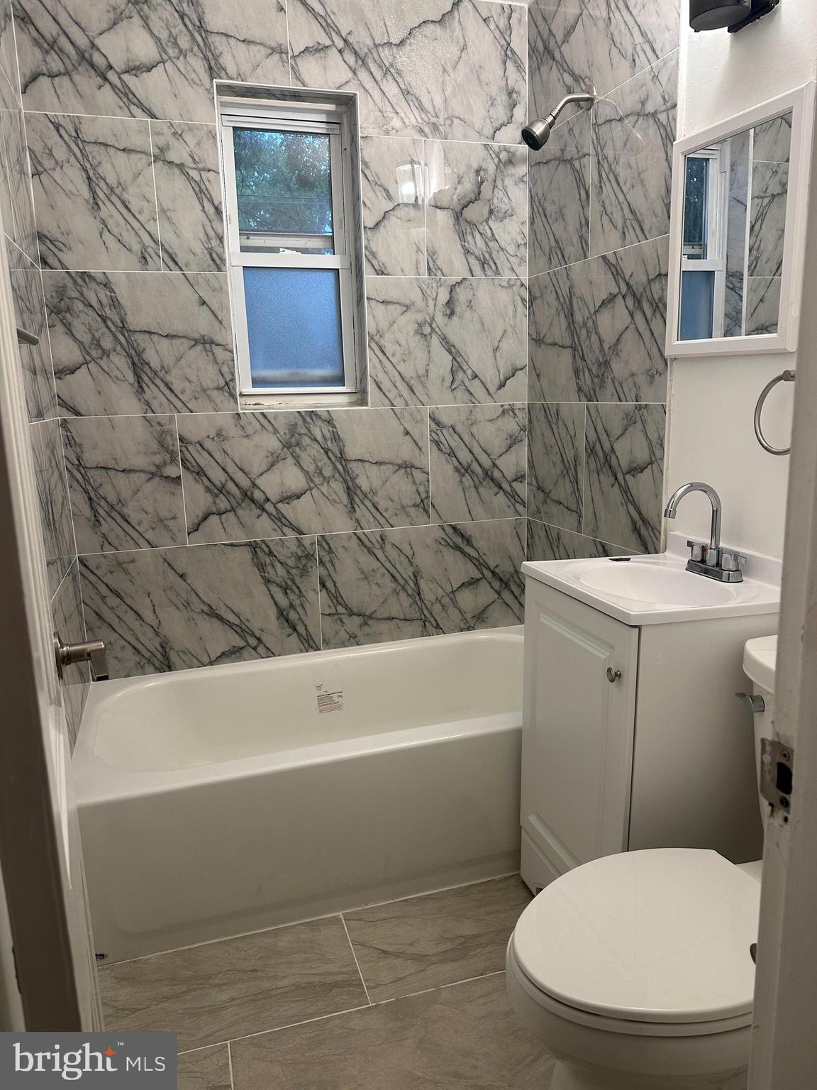 8411 11th Avenue Silver Spring, MD 20903 - Photo 6 of 24 a bathroom with a toilet and a sink