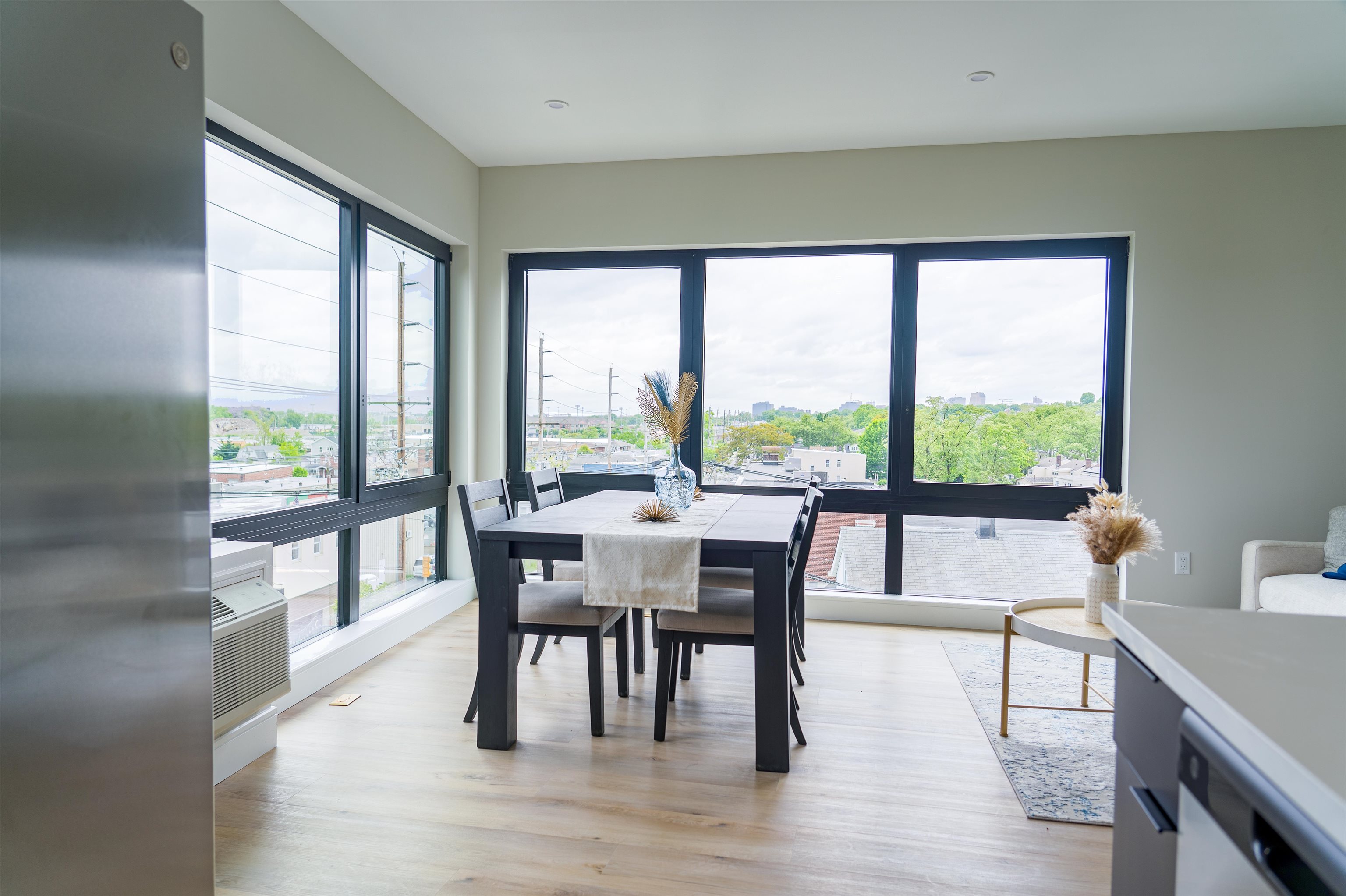 457 Schuyler Avenue, Unit 209 Kearny, NJ 07032 - Photo 12 of 37 a dining room with furniture and wooden floor