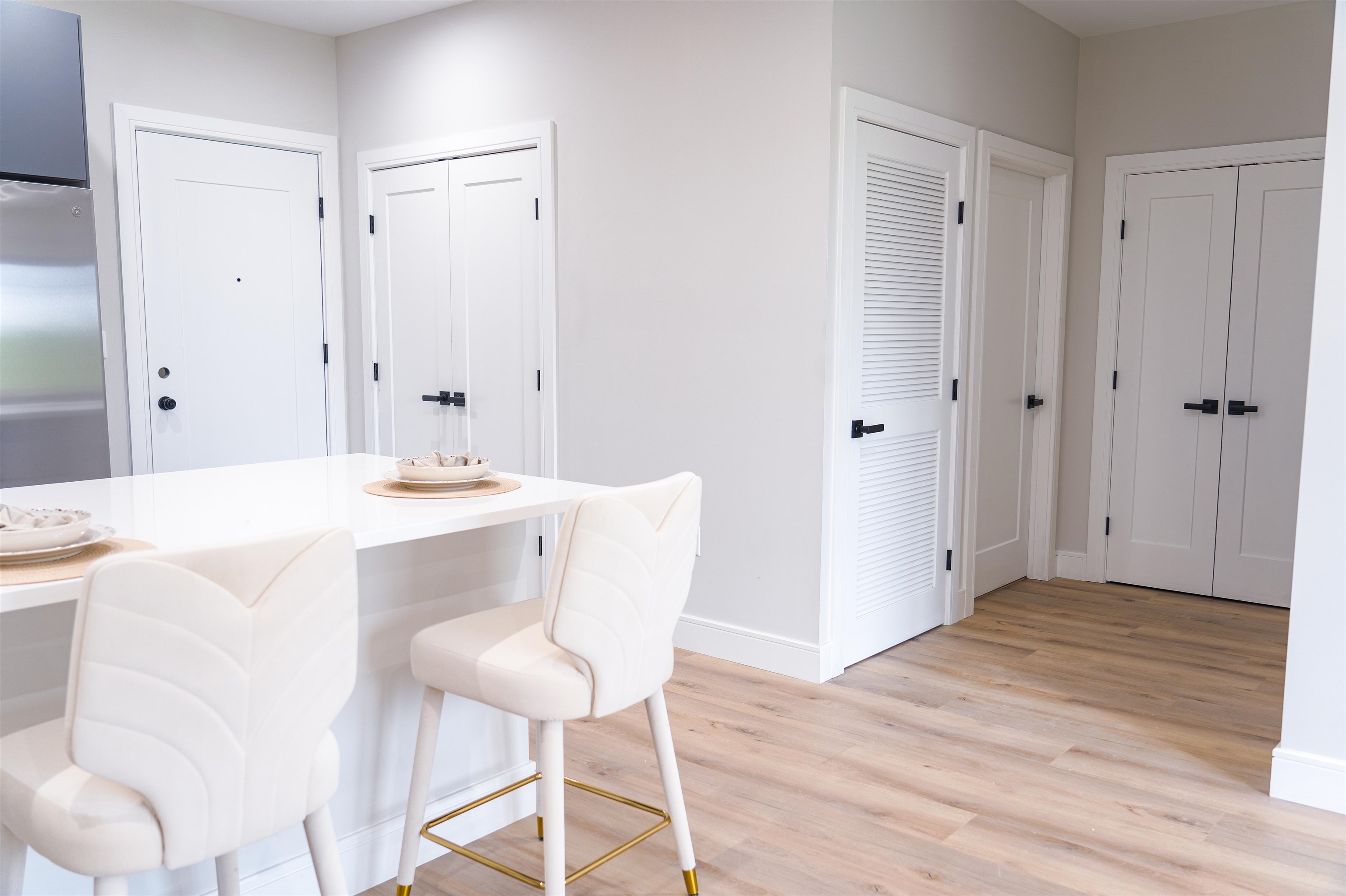 457 Schuyler Avenue, Unit 209 Kearny, NJ 07032 - Photo 13 of 37 a living room with kitchen island a sink cabinets and wooden floor