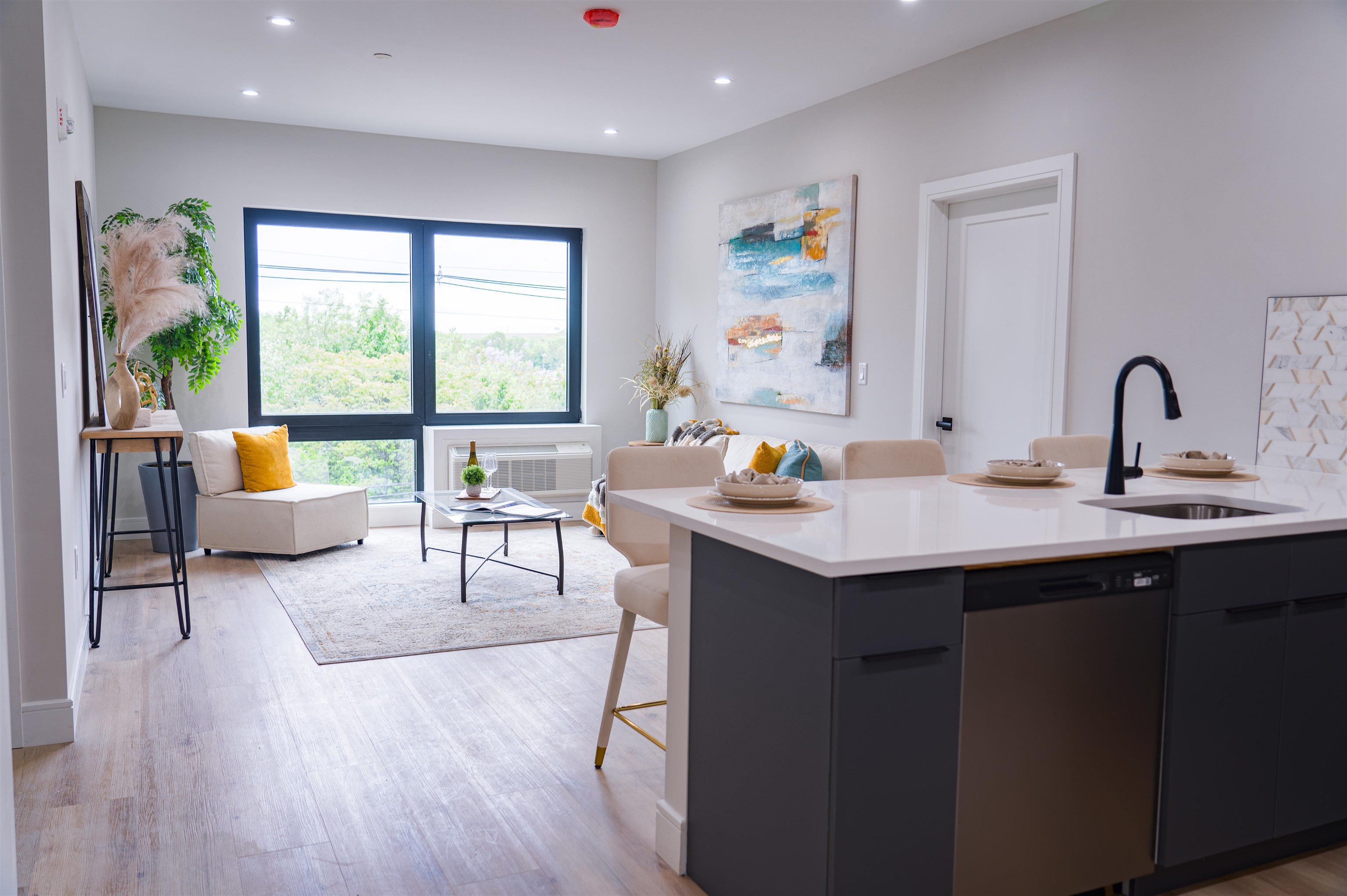 457 Schuyler Avenue, Unit 209 Kearny, NJ 07032 - Photo 15 of 37 a kitchen with a sink a counter and dining room view
