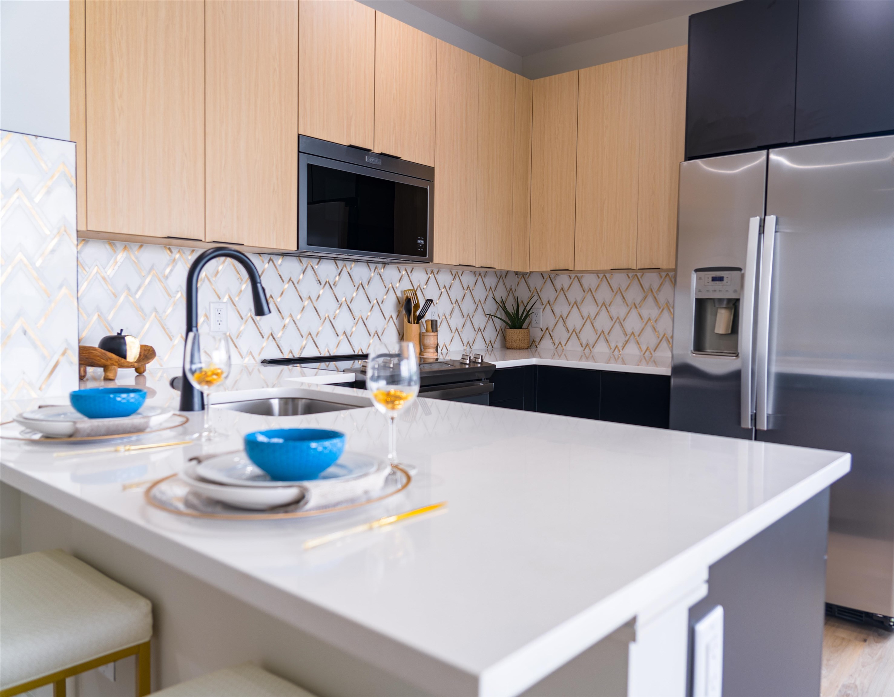 457 Schuyler Avenue, Unit 209 Kearny, NJ 07032 - Photo 16 of 37 a kitchen with a sink a stove and refrigerator