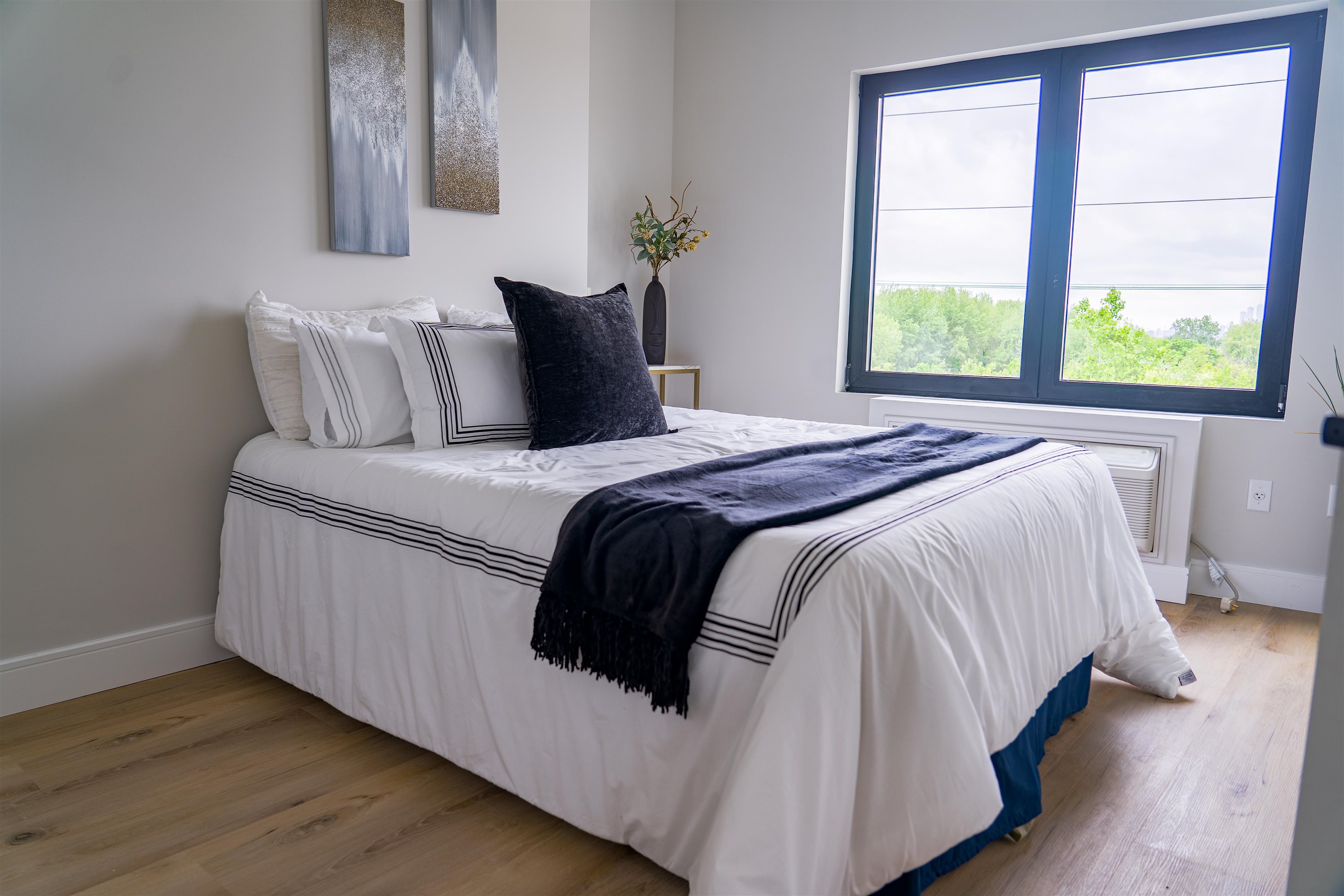 457 Schuyler Avenue, Unit 209 Kearny, NJ 07032 - Photo 19 of 37 a bedroom with a bed and a window