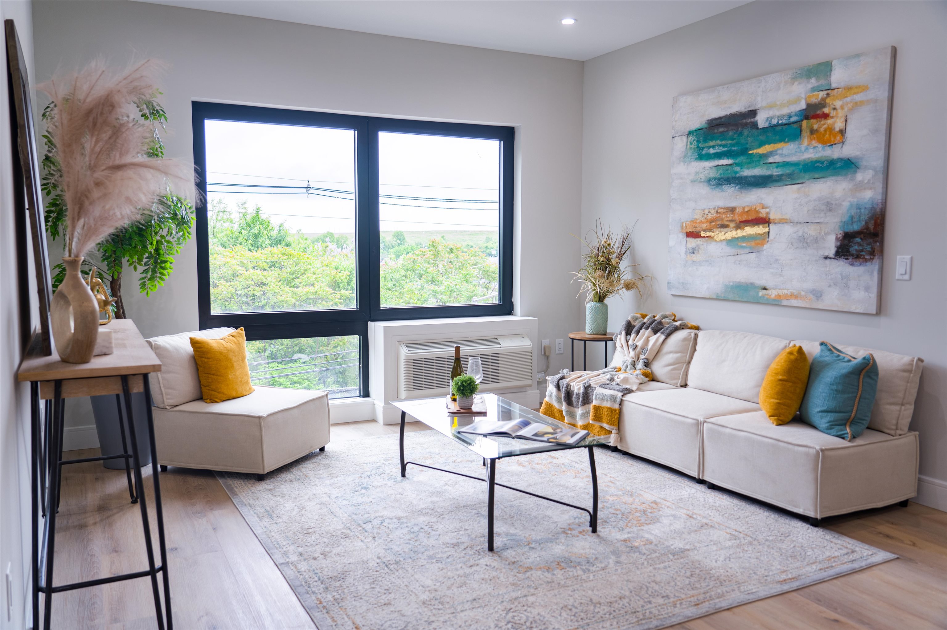 457 Schuyler Avenue, Unit 209 Kearny, NJ 07032 - Photo 2 of 37 a living room with furniture and a large window
