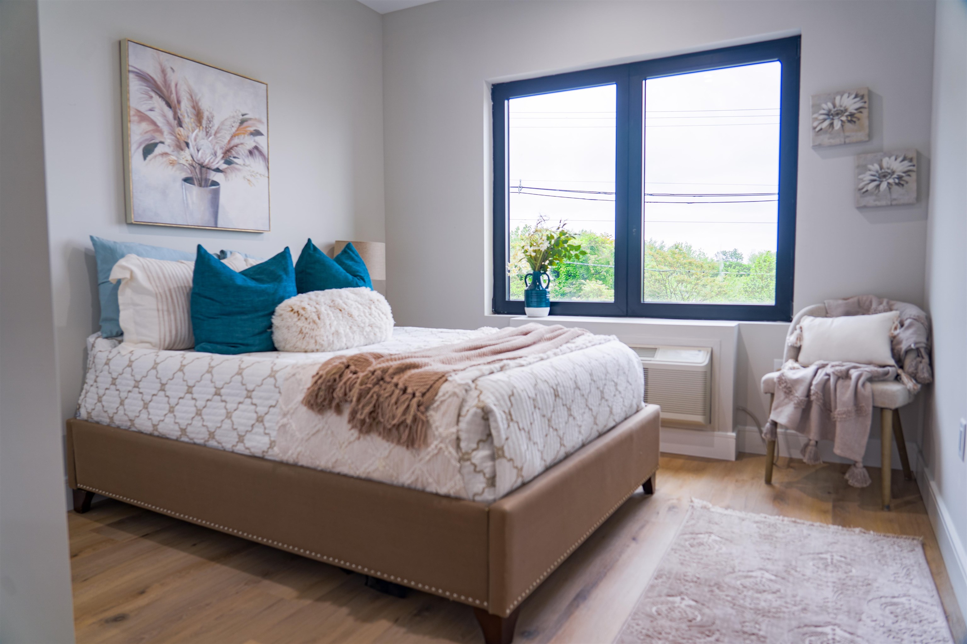 457 Schuyler Avenue, Unit 209 Kearny, NJ 07032 - Photo 21 of 37 a bed sitting in a bedroom next to a window