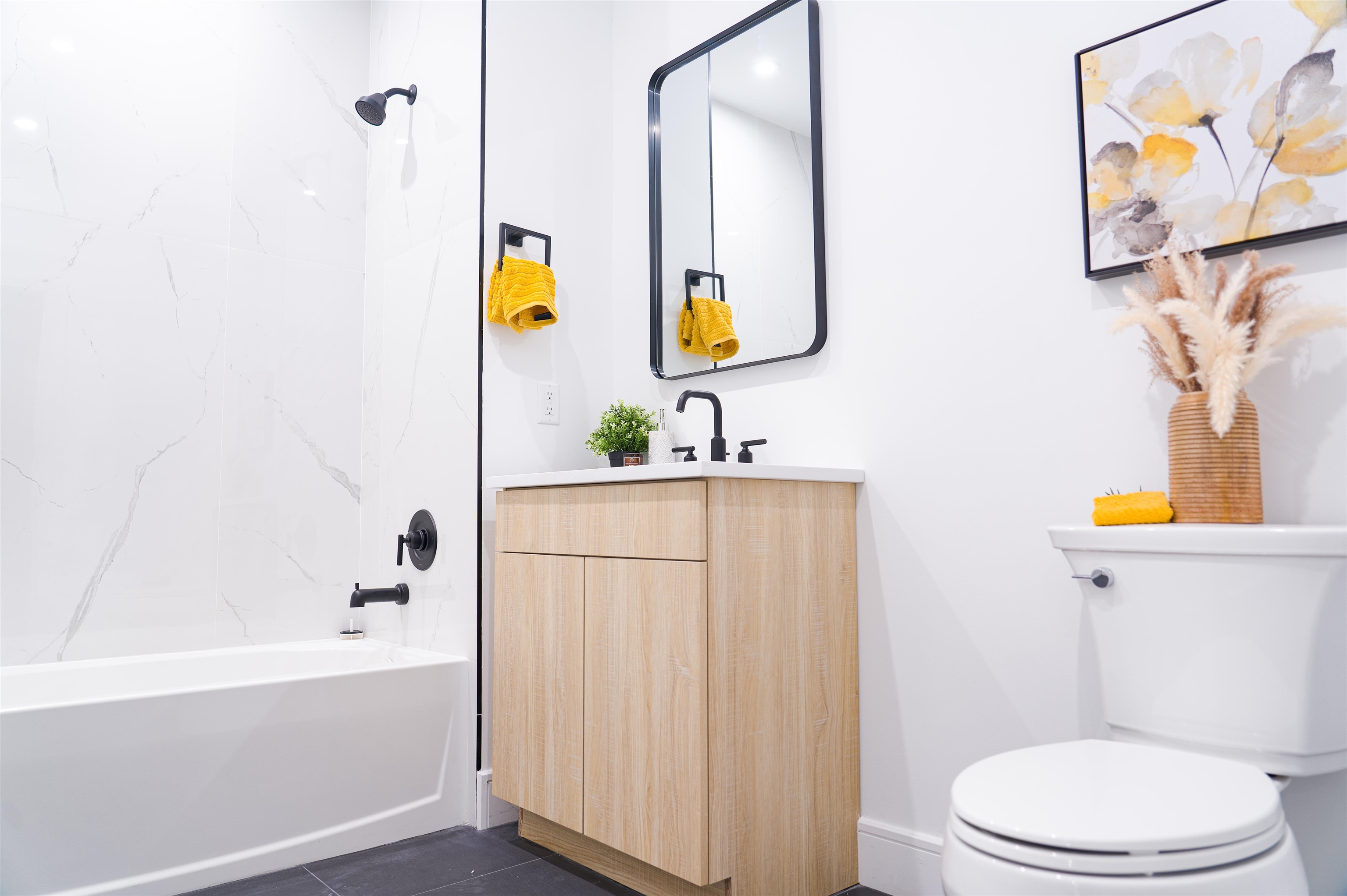 457 Schuyler Avenue, Unit 209 Kearny, NJ 07032 - Photo 24 of 37 a bathroom with a sink vanity mirror and toilet