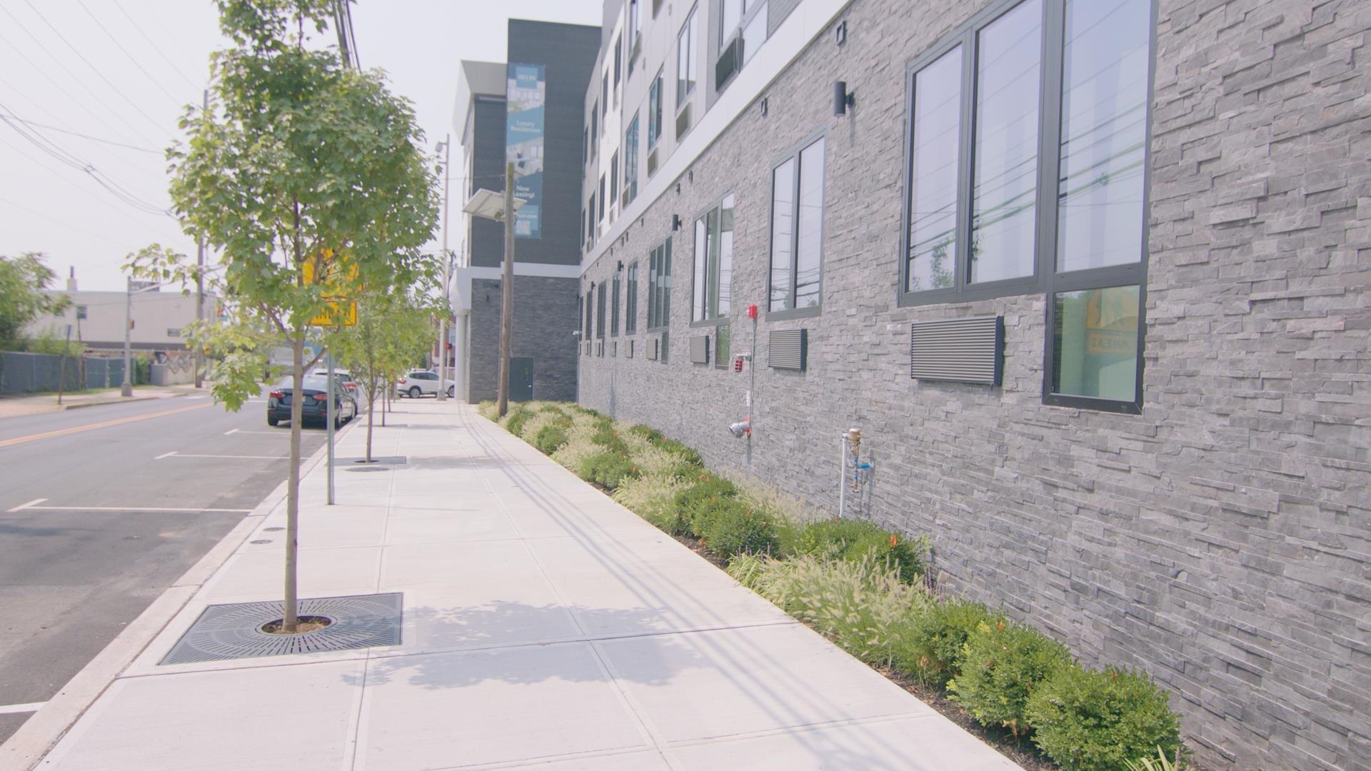 457 Schuyler Avenue, Unit 209 Kearny, NJ 07032 - Photo 33 of 37 a view of a pathway with a building