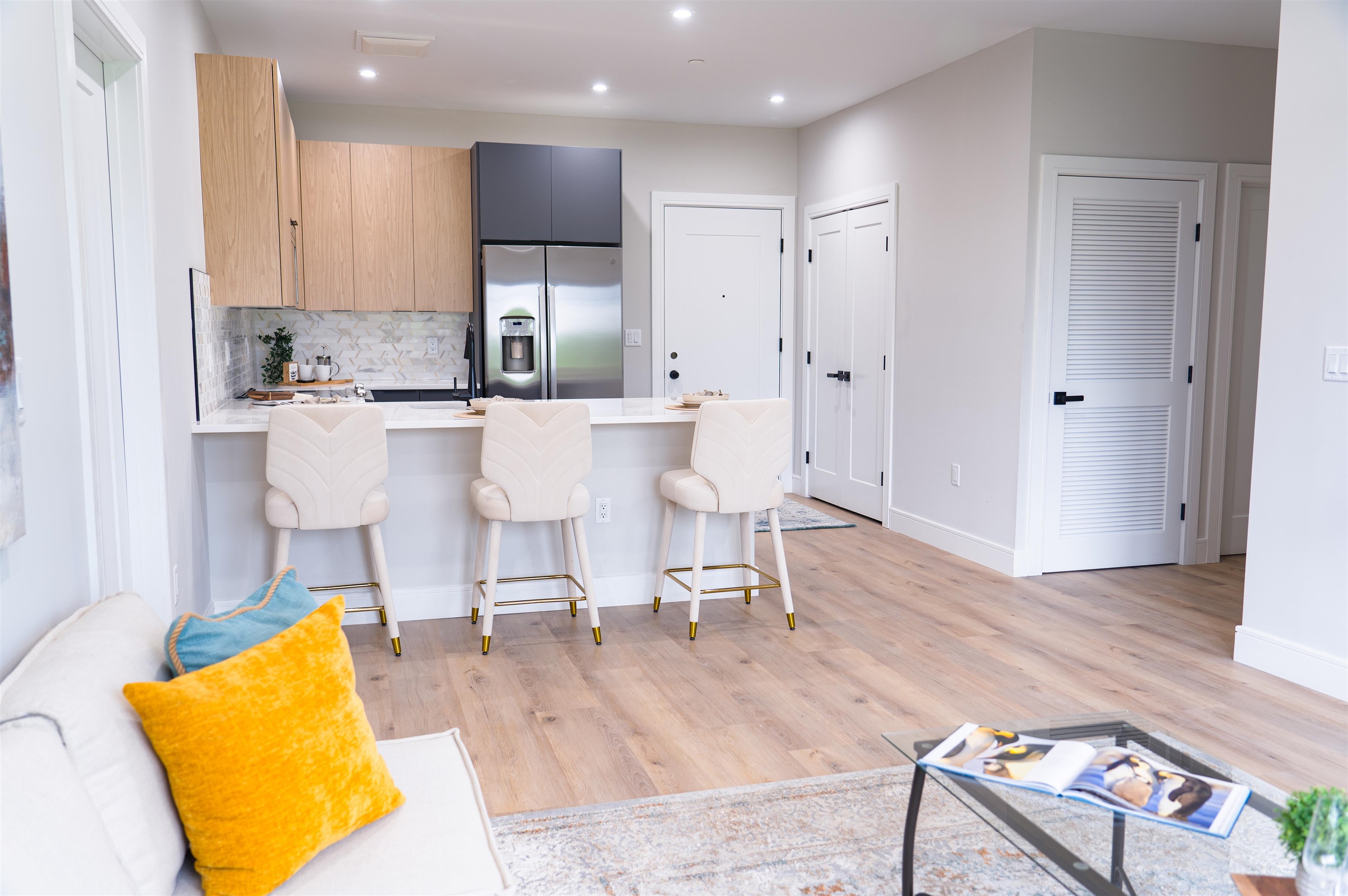 457 Schuyler Avenue, Unit 209 Kearny, NJ 07032 - Photo 6 of 37 a living room with stainless steel appliances kitchen island granite countertop furniture and a wooden floor