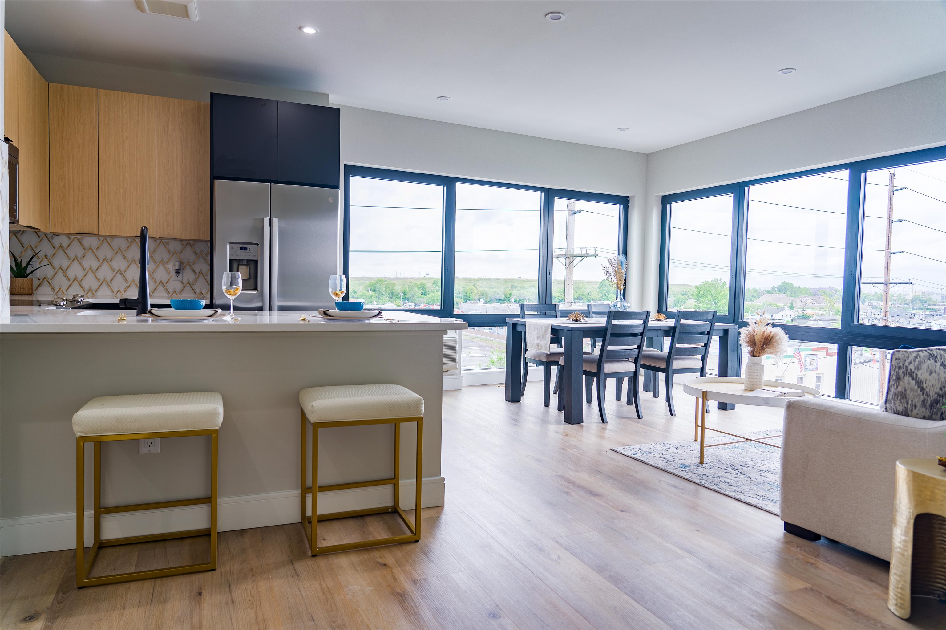 457 Schuyler Avenue, Unit 209 Kearny, NJ 07032 - Photo 7 of 37 a dining room with furniture a large window and wooden floor
