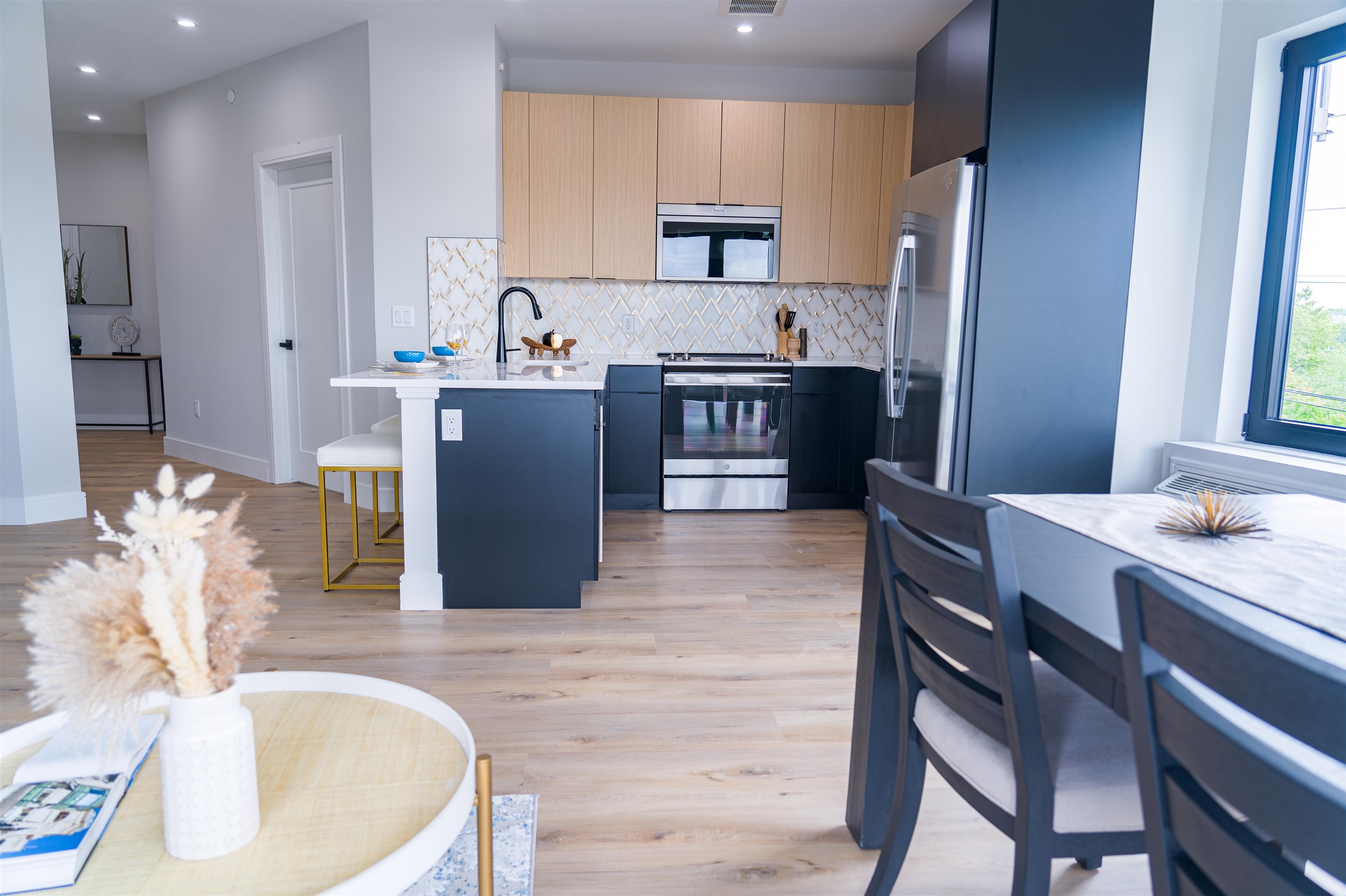 457 Schuyler Avenue, Unit 209 Kearny, NJ 07032 - Photo 9 of 37 a kitchen with a table and chairs