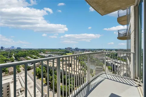 a view of a balcony with city