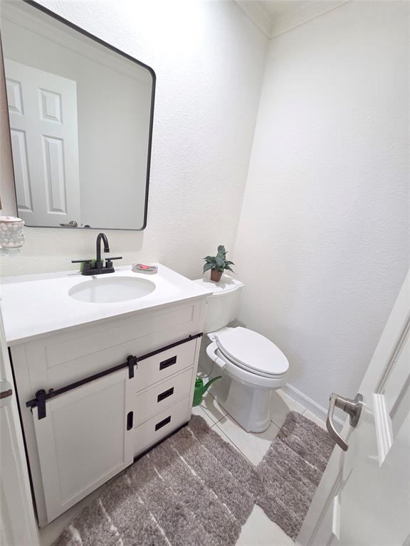 3908 Denham Way Plano, TX 75023 - Photo 12 of 23 a bathroom with a sink vanity mirror and toilet