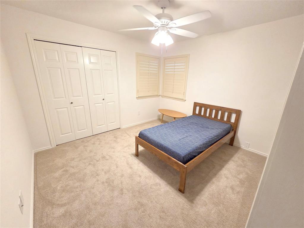 3908 Denham Way Plano, TX 75023 - Photo 22 of 23 a view of a room with a ceiling fan and wooden floor