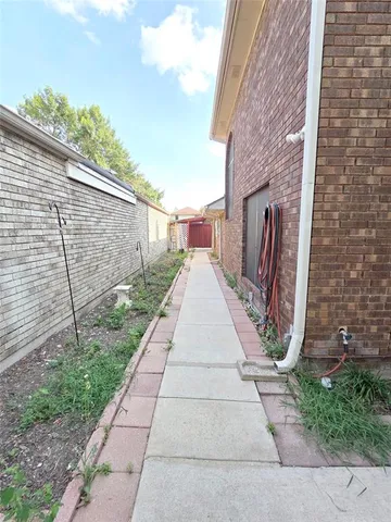 a view of a pathway with a backyard