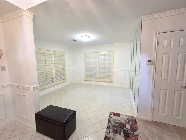 a bathroom with a bathtub and a window