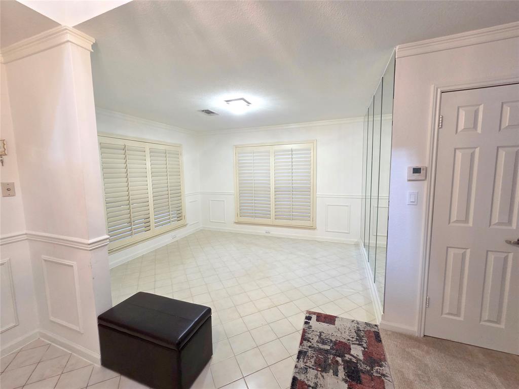 3908 Denham Way Plano, TX 75023 - Photo 8 of 23 a bathroom with a bathtub and a window