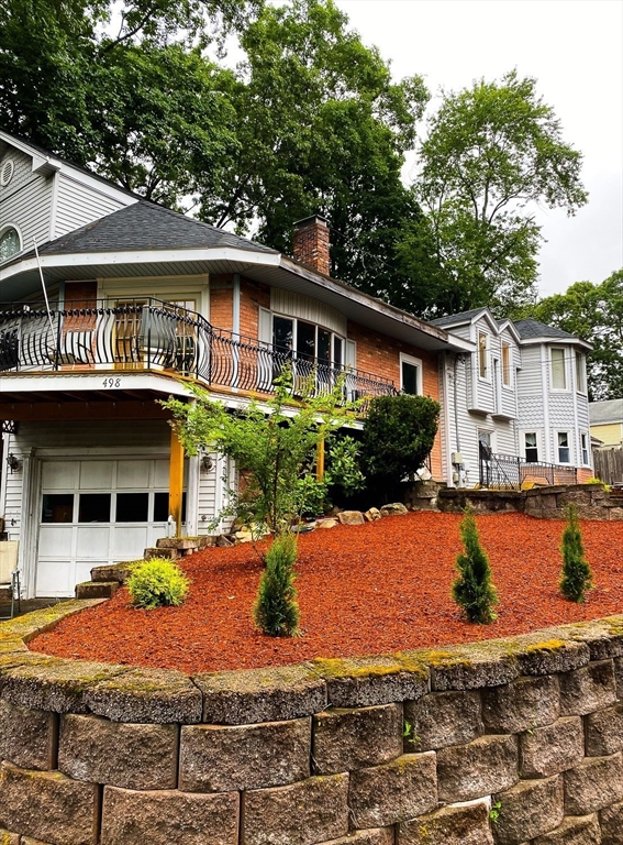 498 Middlesex Turnpike Billerica, MA 01821 - Photo 8 of 21 a front view of a house with swimming pool