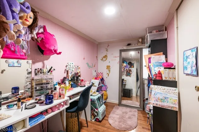 a view of a room with workspace and toys