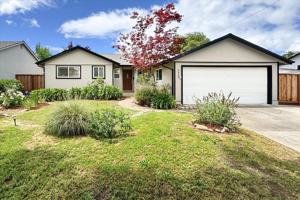 5459 Clovercrest Drive San Jose, CA 95118 - Photo 1 of 23 a front view of a house with a yard and garage