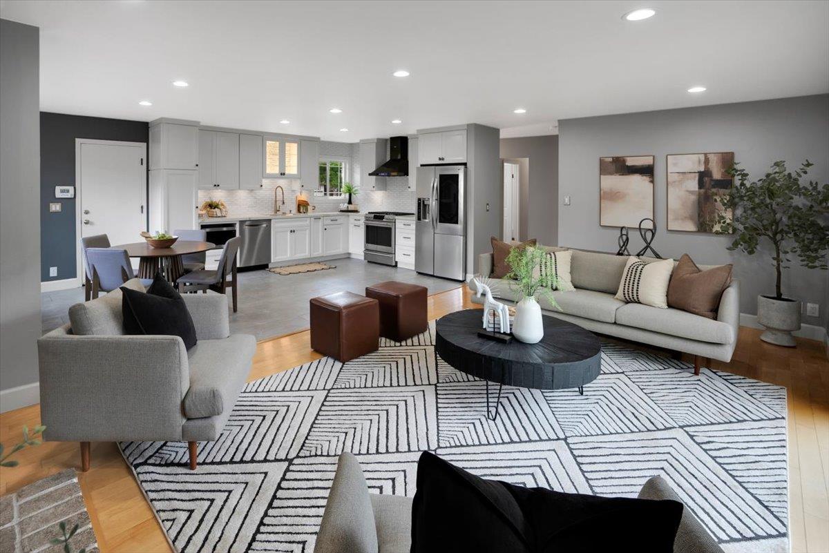 5459 Clovercrest Drive San Jose, CA 95118 - Photo 5 of 23 a living room with furniture a rug kitchen view and a chandelier