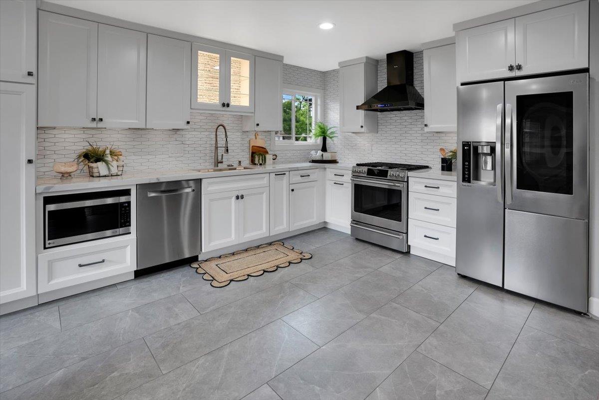 5459 Clovercrest Drive San Jose, CA 95118 - Photo 8 of 23 a kitchen with stainless steel appliances white cabinets and a stove