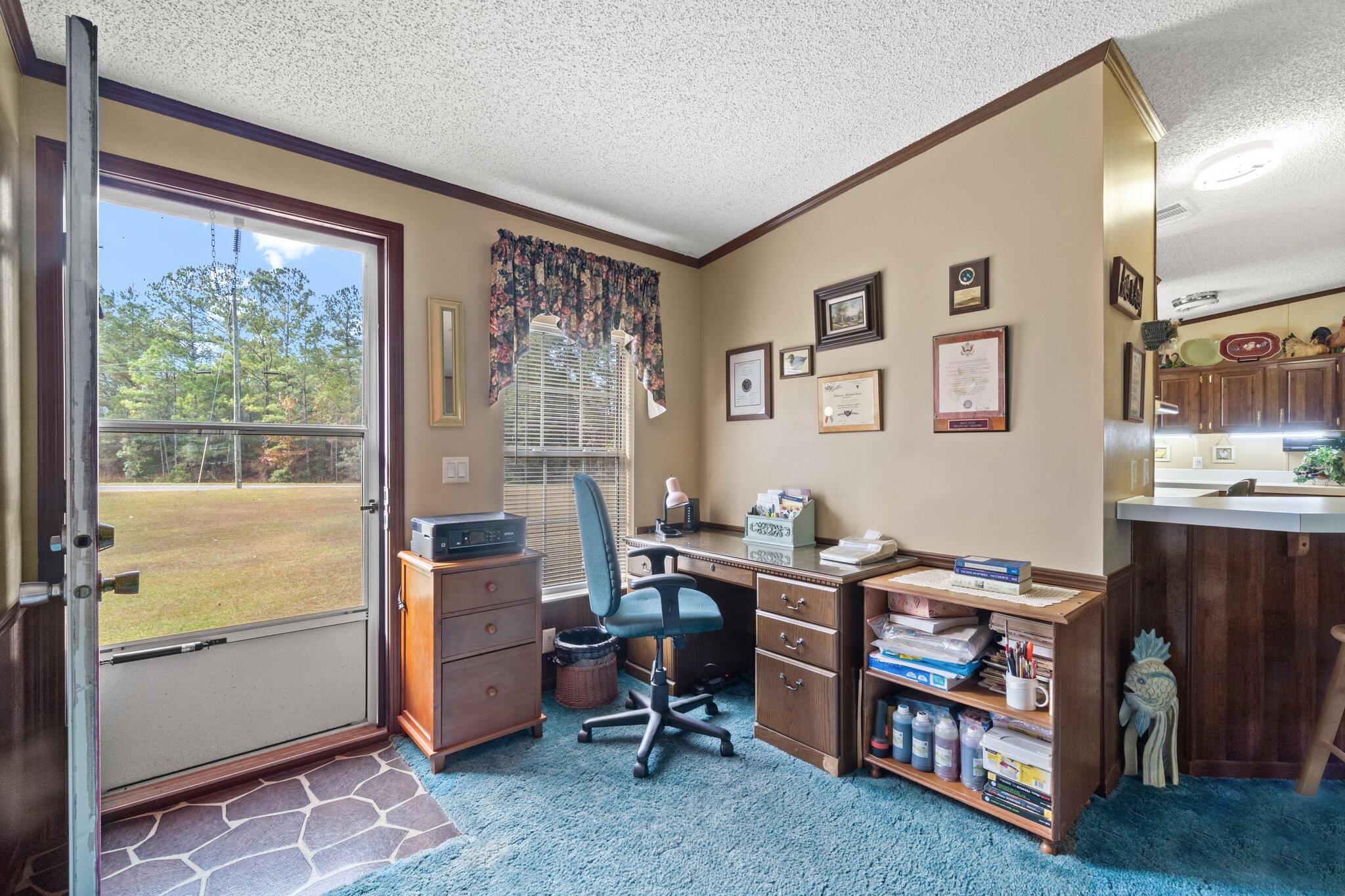 4281 Shell Landing Road Vernon, FL 32462 - Photo 11 of 55 a view of a workspace with furniture and a window