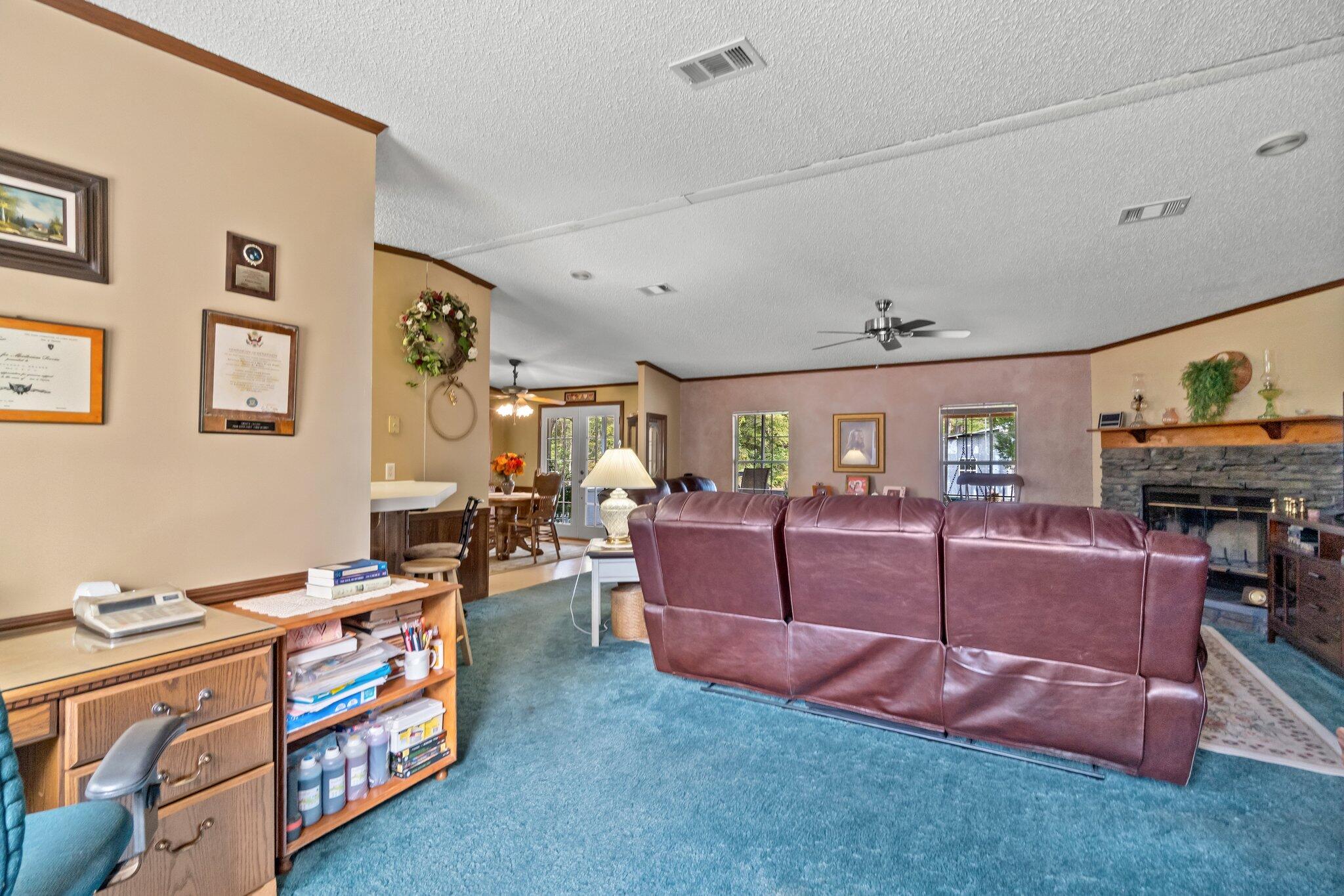 4281 Shell Landing Road Vernon, FL 32462 - Photo 12 of 55 a living room with furniture and a flat screen tv