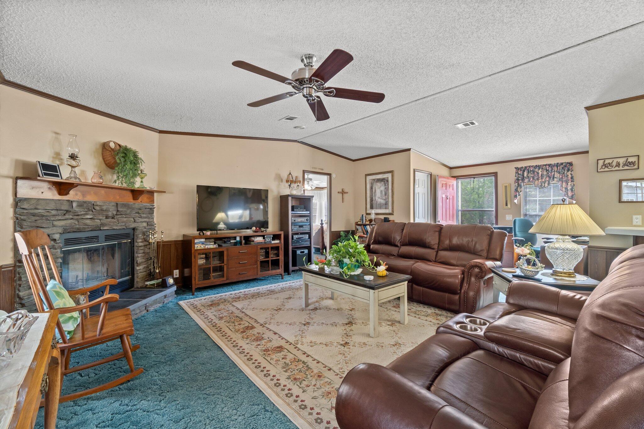 4281 Shell Landing Road Vernon, FL 32462 - Photo 15 of 55 a living room with furniture and a fireplace