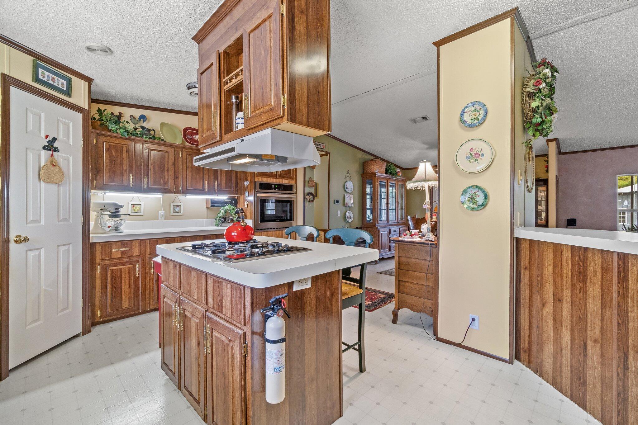 4281 Shell Landing Road Vernon, FL 32462 - Photo 19 of 55 a kitchen that has a stove and a table