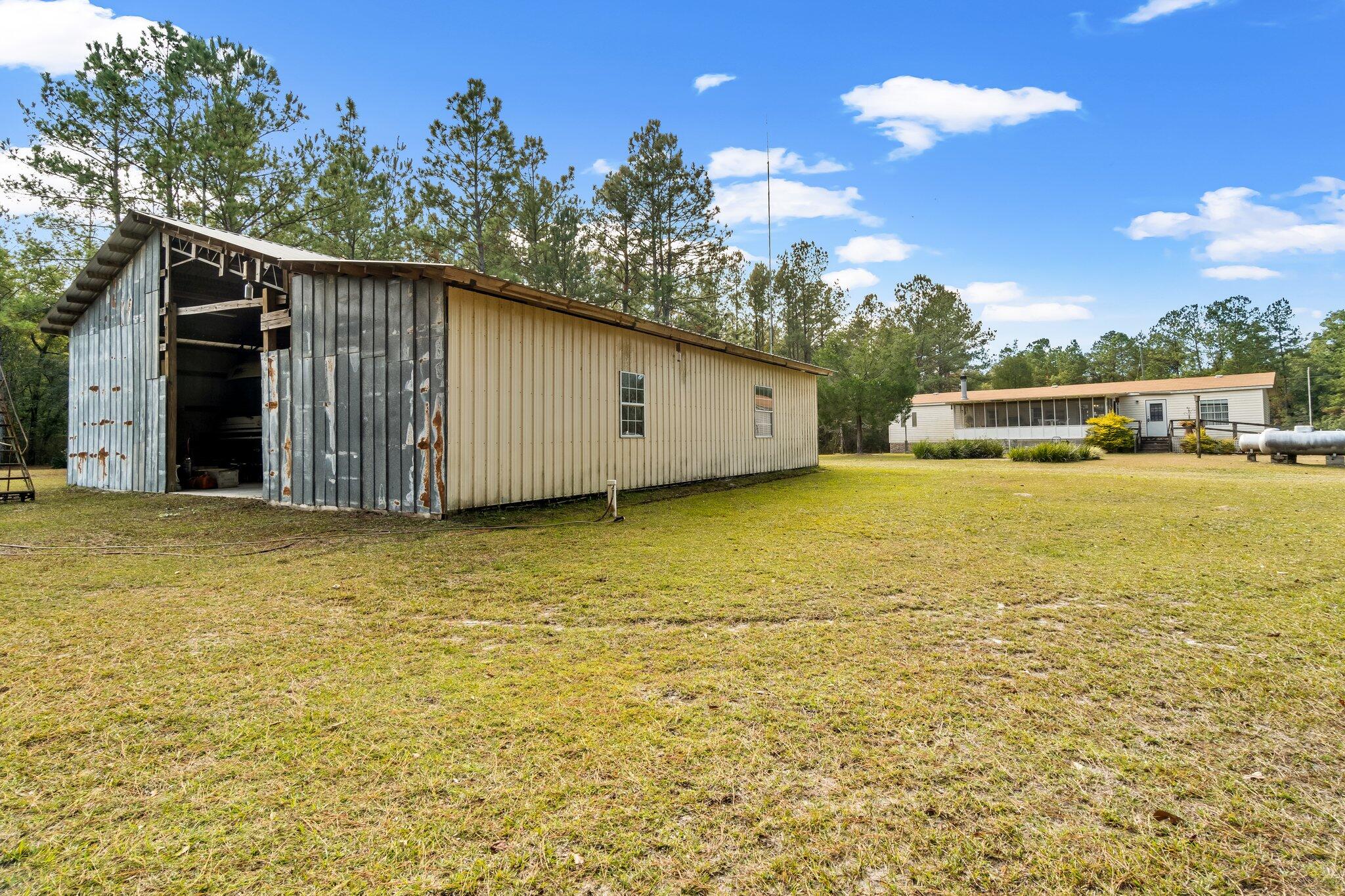 4281 Shell Landing Road Vernon, FL 32462 - Photo 37 of 55 a view of a ocean with a yard