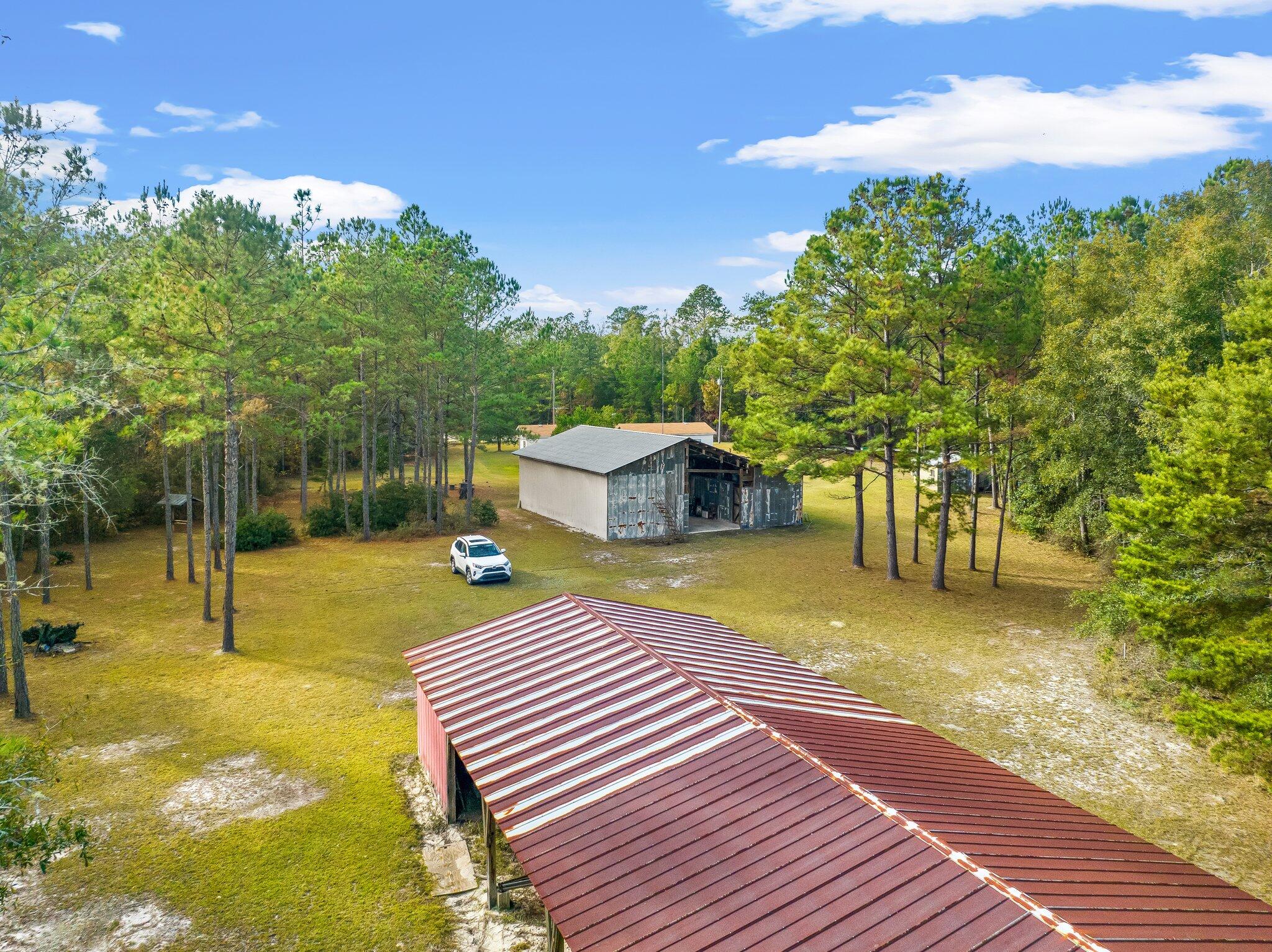 4281 Shell Landing Road Vernon, FL 32462 - Photo 41 of 55 a view of a swimming pool with a patio