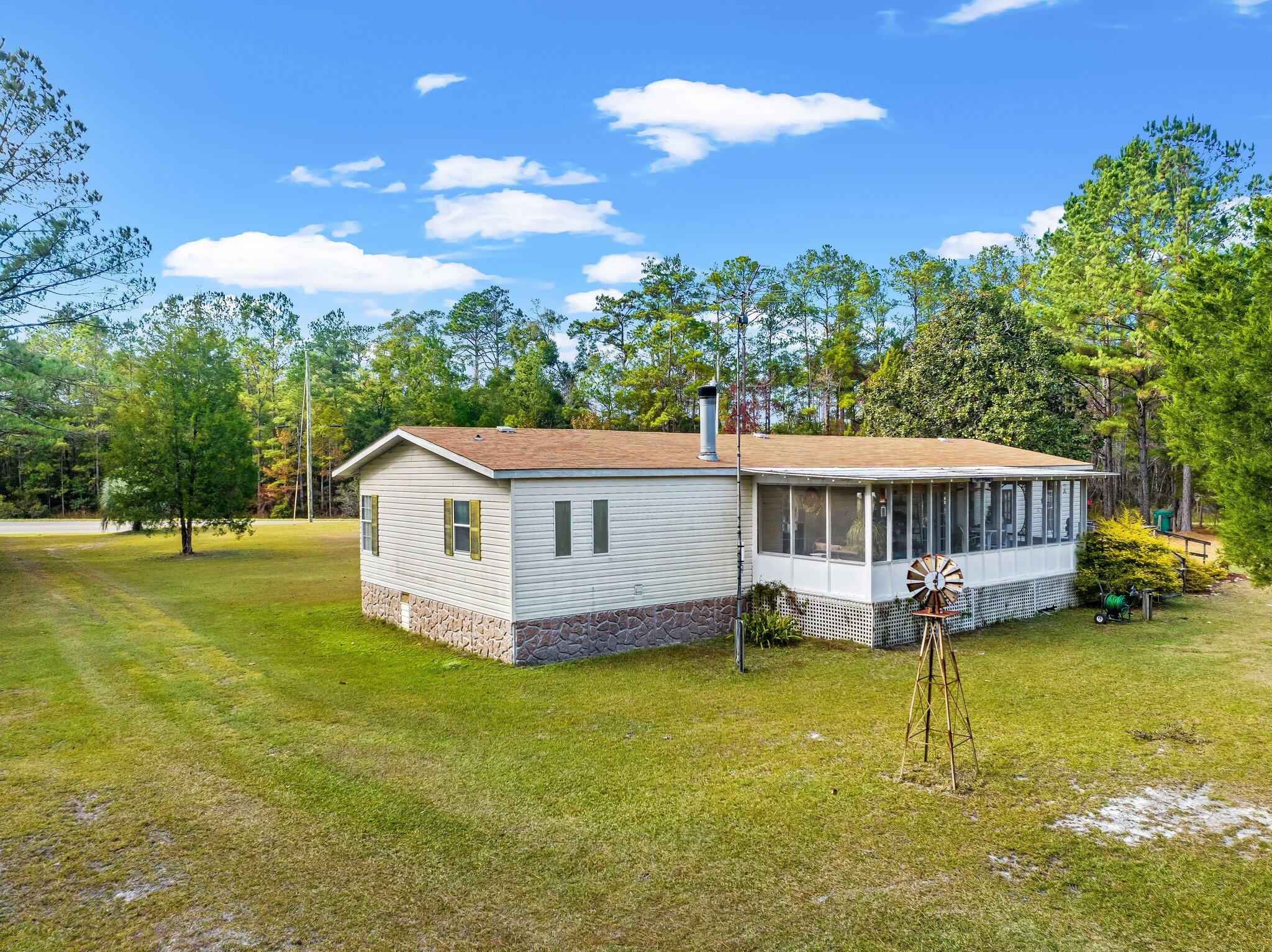 4281 Shell Landing Road Vernon, FL 32462 - Photo 5 of 55 a view of a house with pool yard and balcony