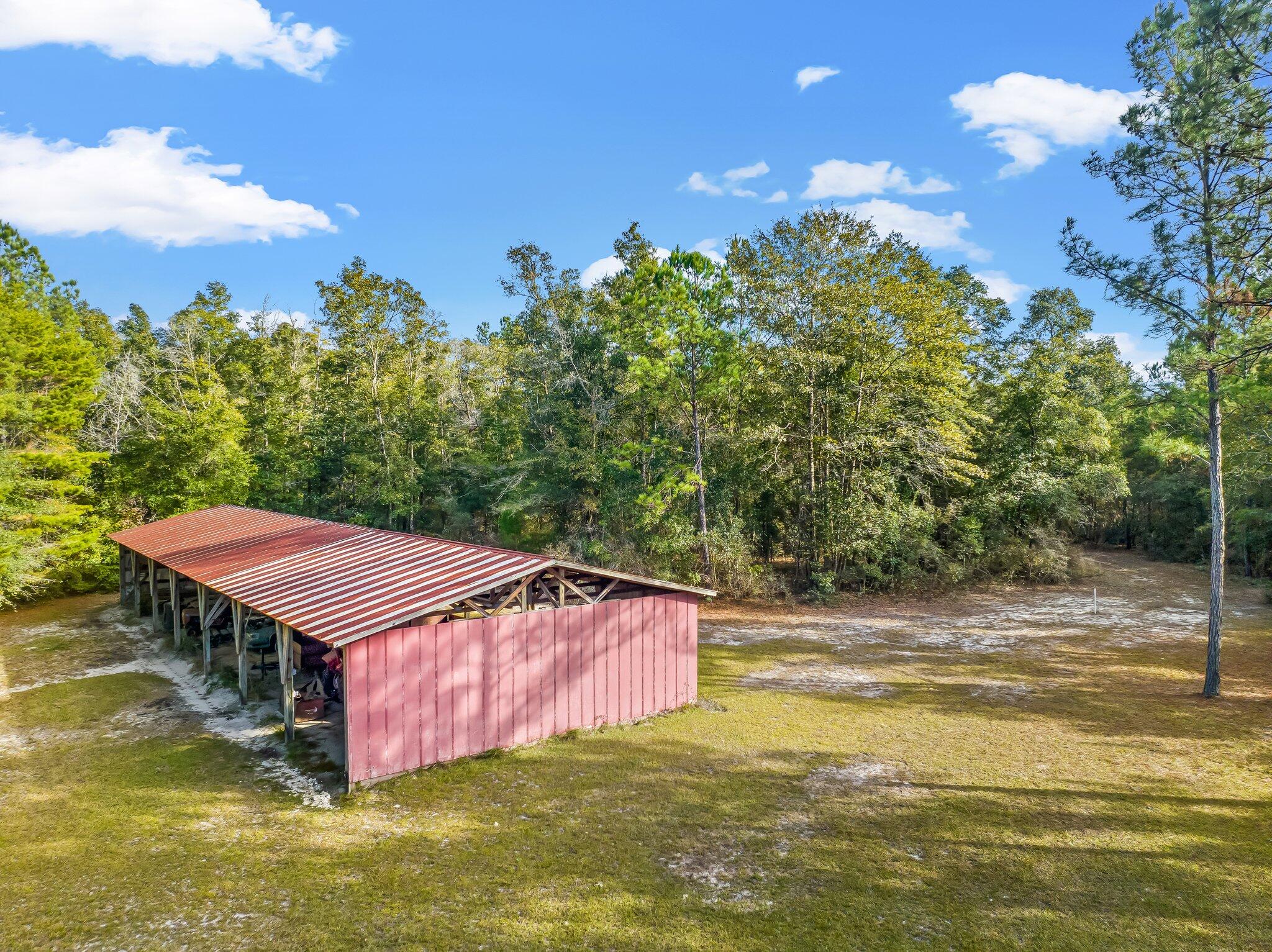 4281 Shell Landing Road Vernon, FL 32462 - Photo 8 of 55 a aerial view of a house with a yard