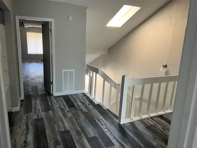 a view of a porch with wooden floor and stairs