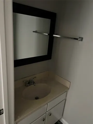 a bathroom with a shower and a sink