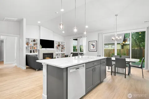 a view of living room with furniture and book shelf