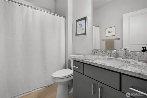 a workspace with furniture window and wooden floor