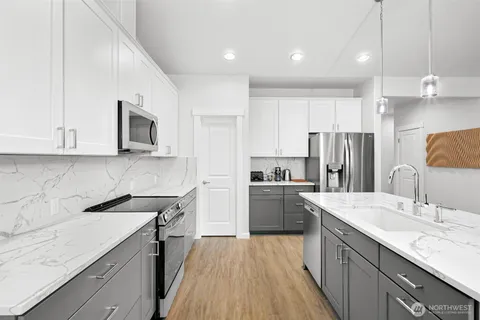 a bedroom with a bed and a lamp