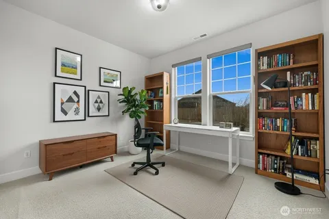 a bathroom with double vanity sinks and a mirror