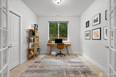 a spacious bedroom with a bed and a cabinets