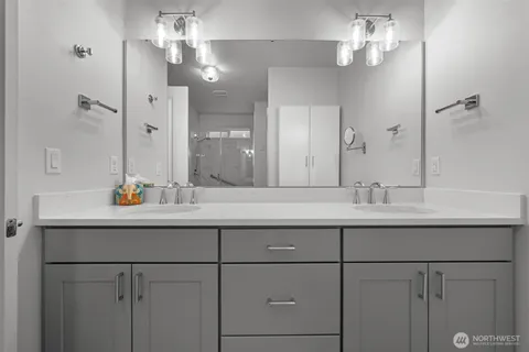 a living room with furniture and large windows