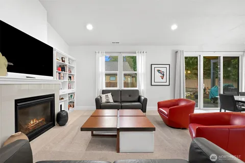 a kitchen with kitchen island a dining table and chairs