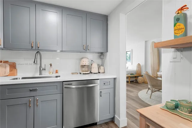 a kitchen with a sink and cabinets