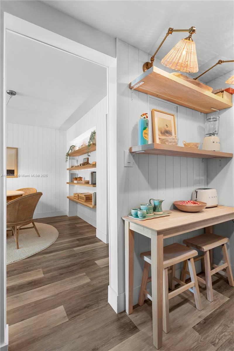 4301 Collins Avenue, Unit 207 Miami Beach, FL 33140 - Photo 12 of 34 a view of a dining room with a table and chairs