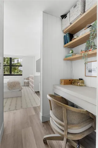 a room with a couch and chairs