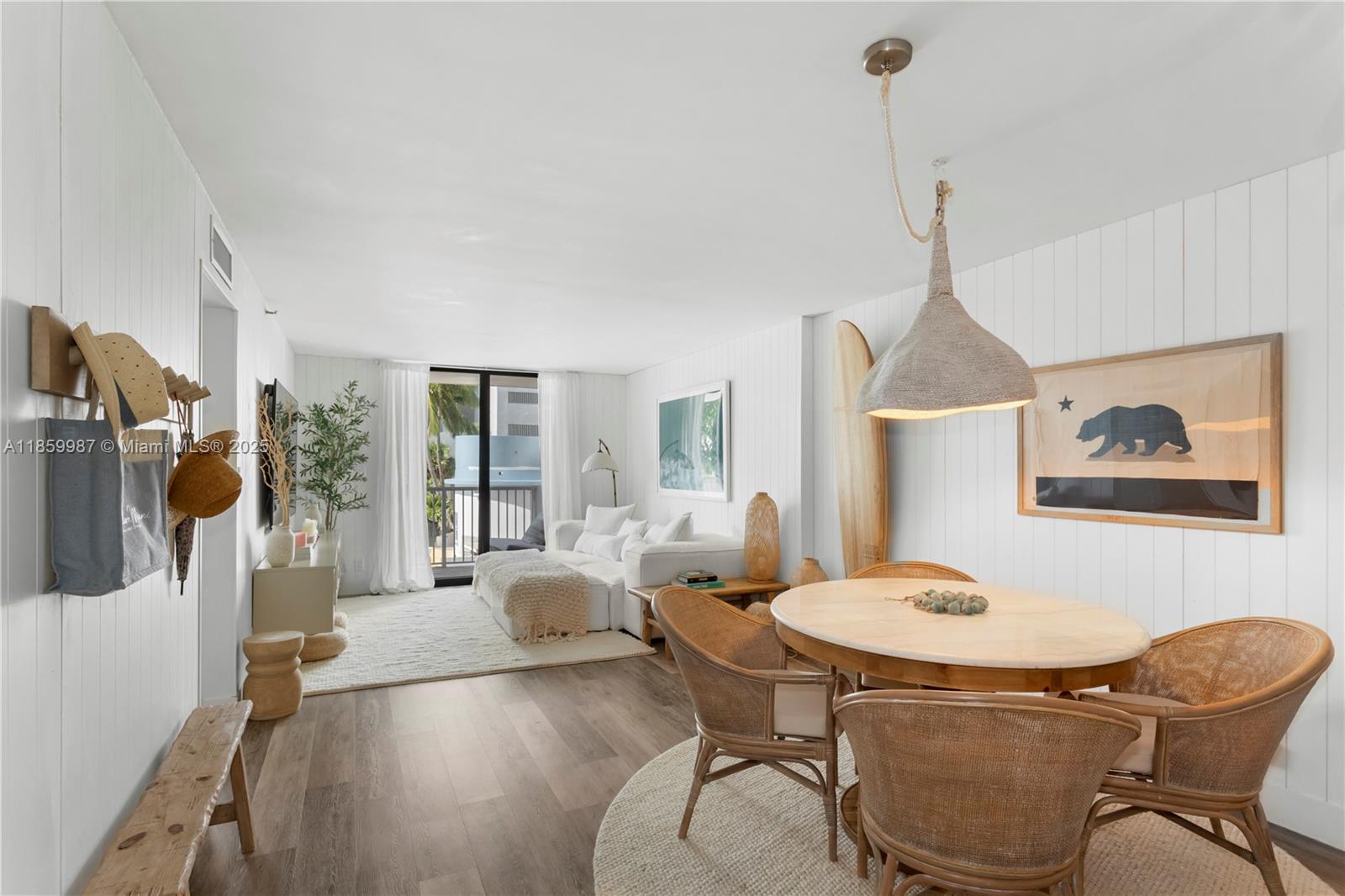 4301 Collins Avenue, Unit 207 Miami Beach, FL 33140 - Photo 2 of 34 a living room with furniture and a floor to ceiling window