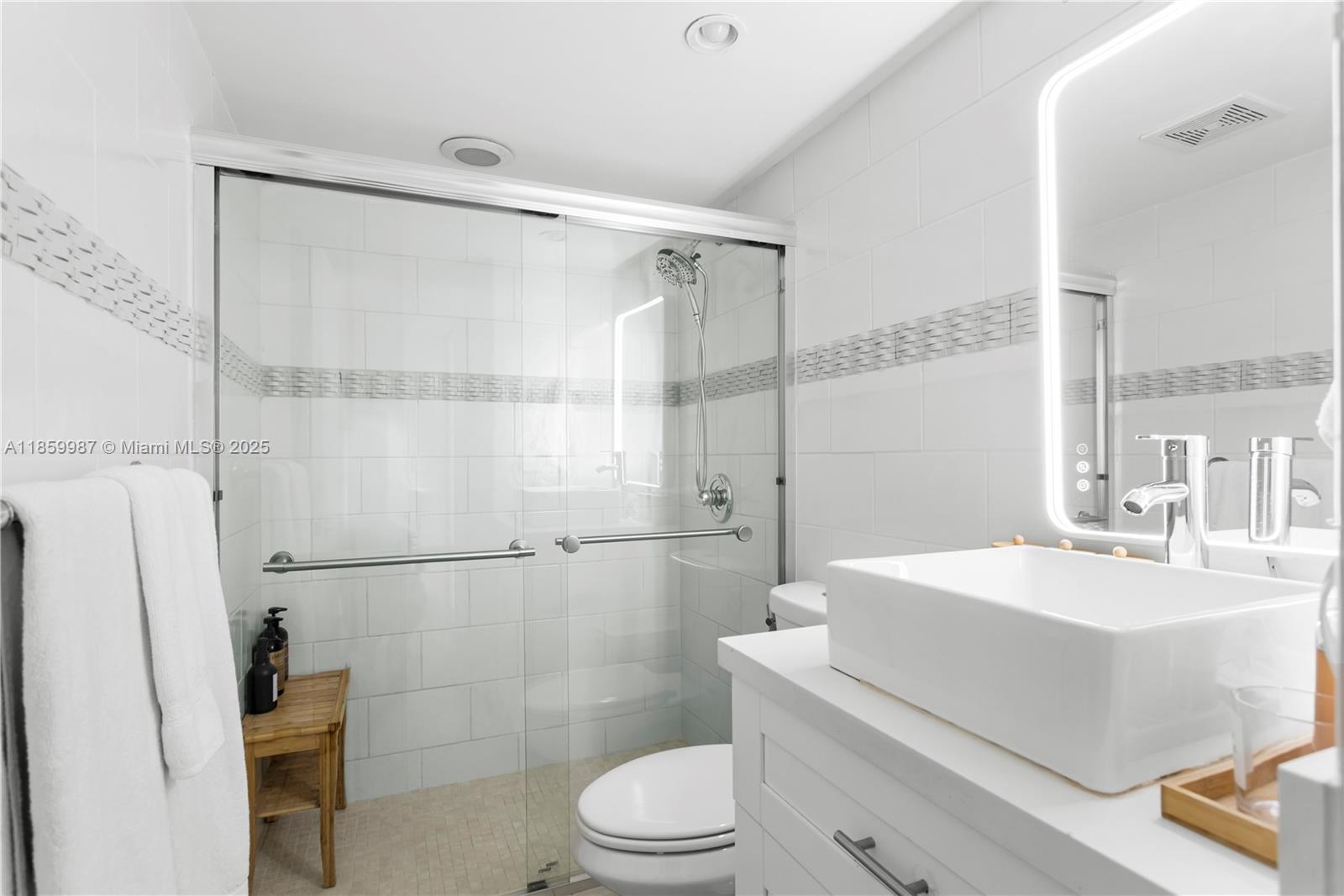 4301 Collins Avenue, Unit 207 Miami Beach, FL 33140 - Photo 25 of 34 a bathroom with a sink a toilet and shower